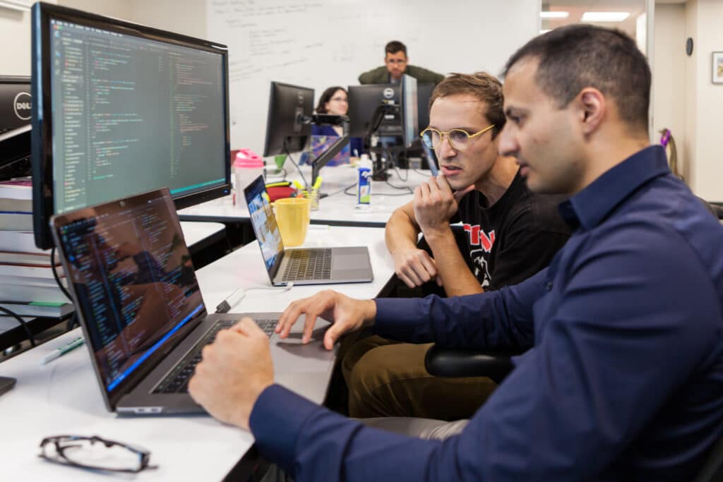 Rithm students working together on computers